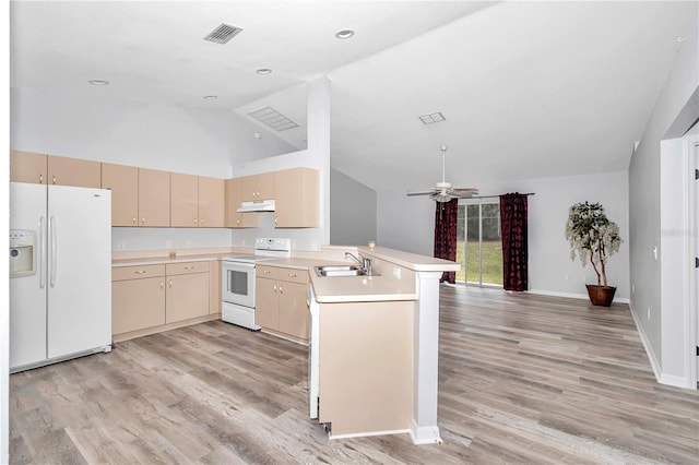 kitchen with light brown cabinetry, ceiling fan, white appliances, light hardwood / wood-style flooring, and kitchen peninsula