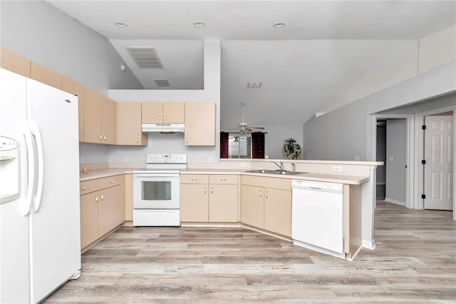 kitchen featuring vaulted ceiling, white appliances, light wood-type flooring, and kitchen peninsula