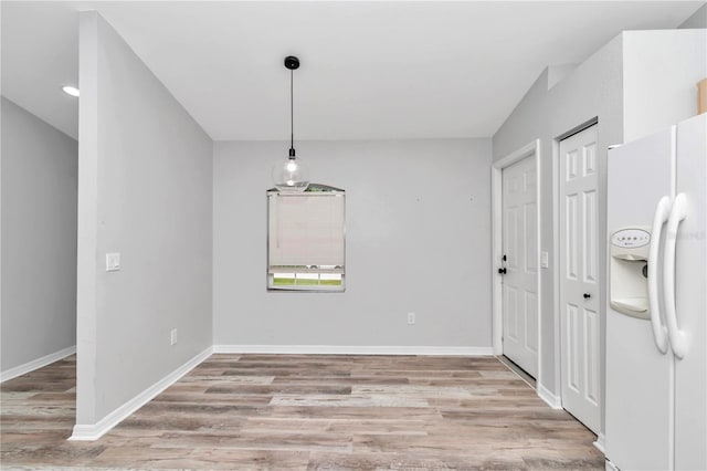 unfurnished dining area featuring hardwood / wood-style flooring