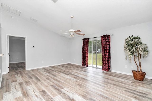 spare room with light hardwood / wood-style flooring, high vaulted ceiling, and ceiling fan