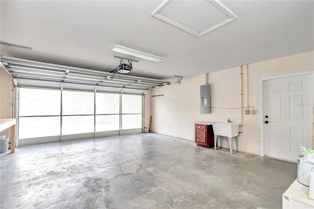 garage featuring electric panel and a garage door opener