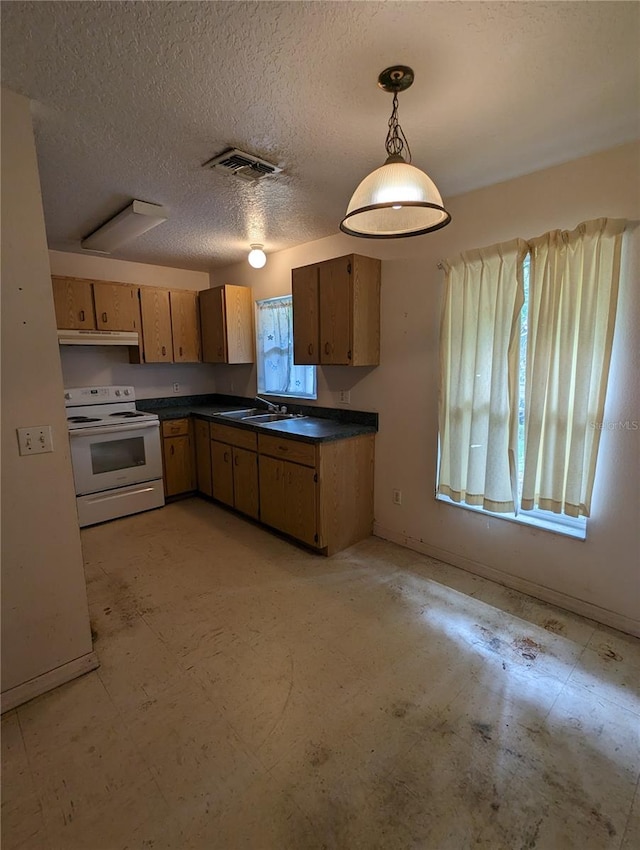 kitchen featuring sink, white electric range, a wealth of natural light, and pendant lighting