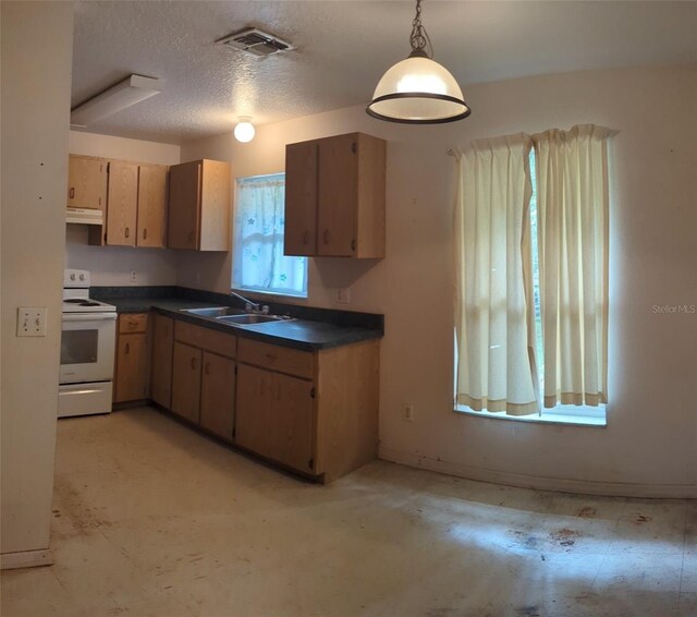 kitchen with sink, a textured ceiling, electric range, and hanging light fixtures