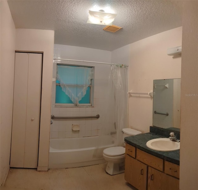 full bathroom with vanity, shower / bathtub combination with curtain, tile patterned floors, toilet, and a textured ceiling