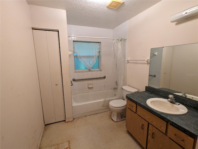 full bathroom featuring tile patterned flooring, a textured ceiling, toilet, shower / tub combo with curtain, and vanity