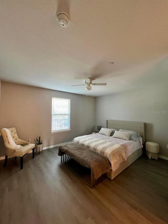 bedroom featuring ceiling fan and hardwood / wood-style floors