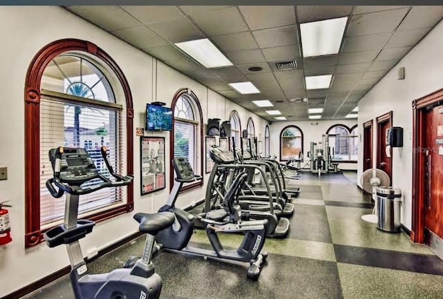 exercise room with a drop ceiling