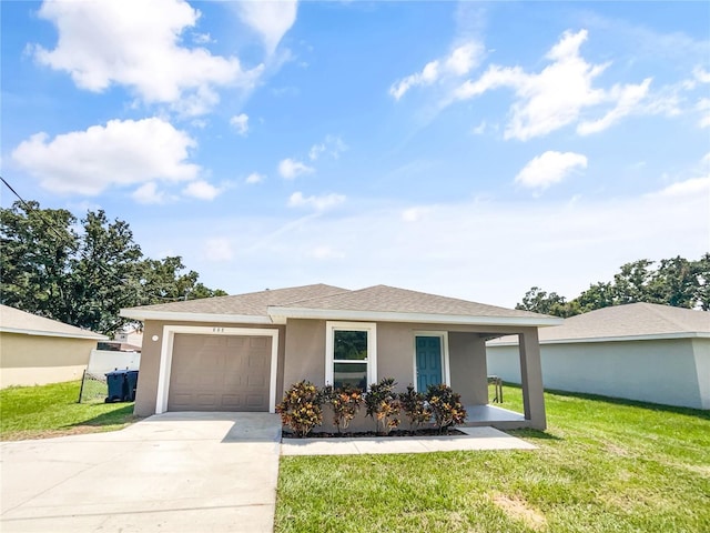 view of front of house featuring a garage, a front yard, and a porch