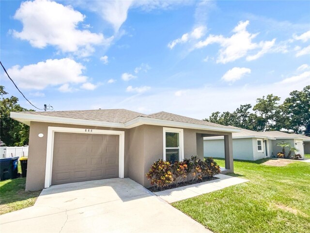 view of front of home with a garage and a front lawn