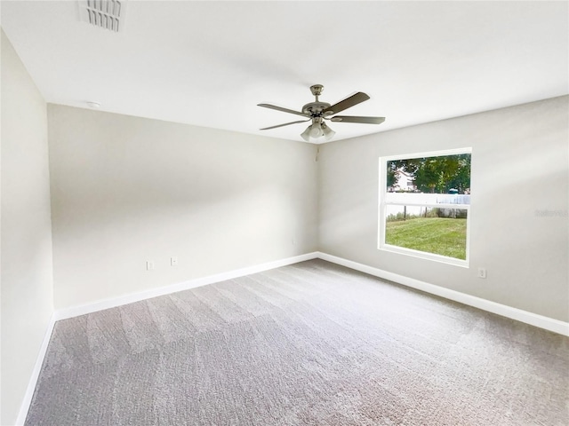 carpeted empty room with ceiling fan