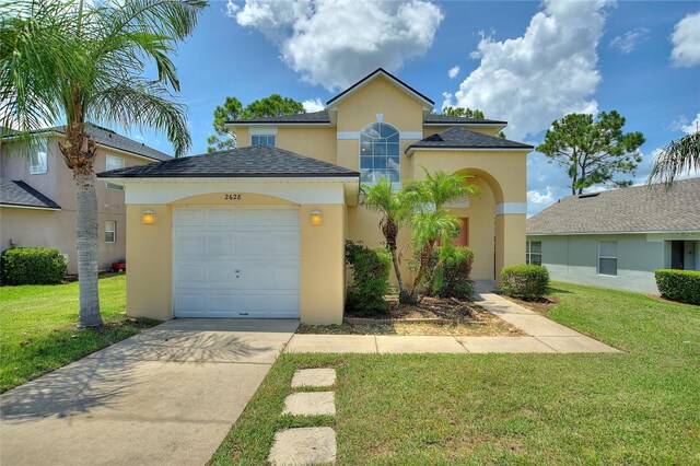 view of front of home featuring a garage and a front lawn