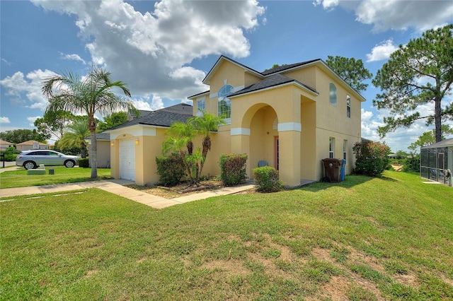 mediterranean / spanish house with a garage and a front yard