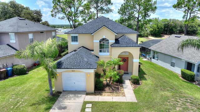 view of front of home with a garage and a front yard