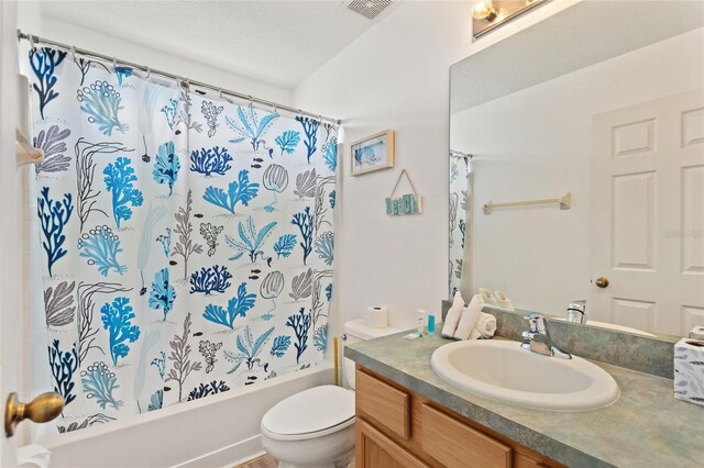 full bathroom with toilet, vanity, and shower / tub combo with curtain