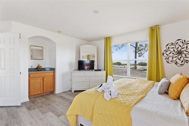 bedroom with light hardwood / wood-style floors