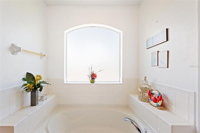 bathroom featuring a washtub