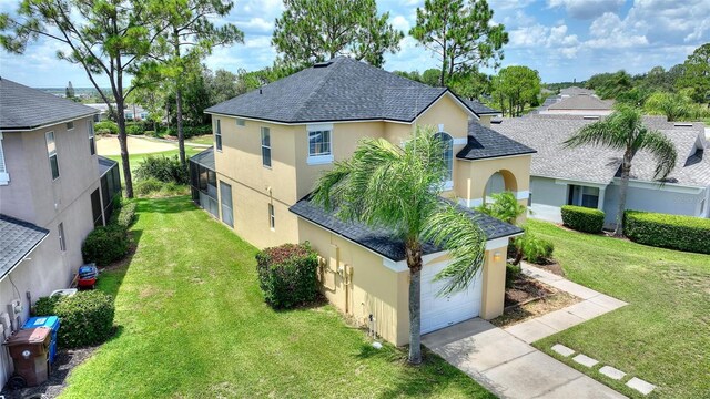 view of front of home with a garage and a front yard