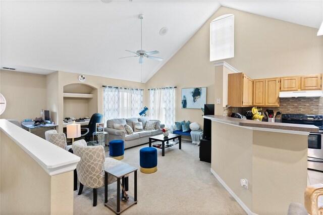 carpeted living room with high vaulted ceiling and ceiling fan