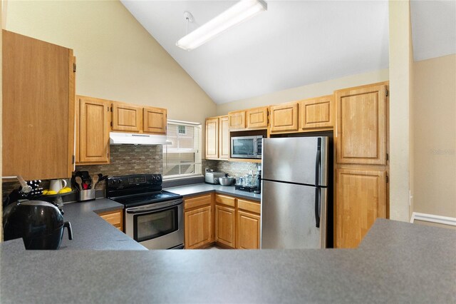 kitchen with light brown cabinetry, tasteful backsplash, high vaulted ceiling, and stainless steel appliances