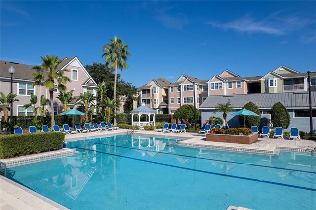 view of swimming pool featuring a patio area and a gazebo