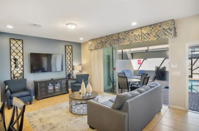 tiled living area featuring recessed lighting, visible vents, and baseboards