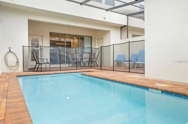 view of swimming pool with a lanai and a fenced in pool