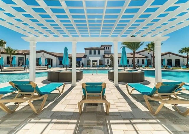 community pool featuring a patio area and a pergola