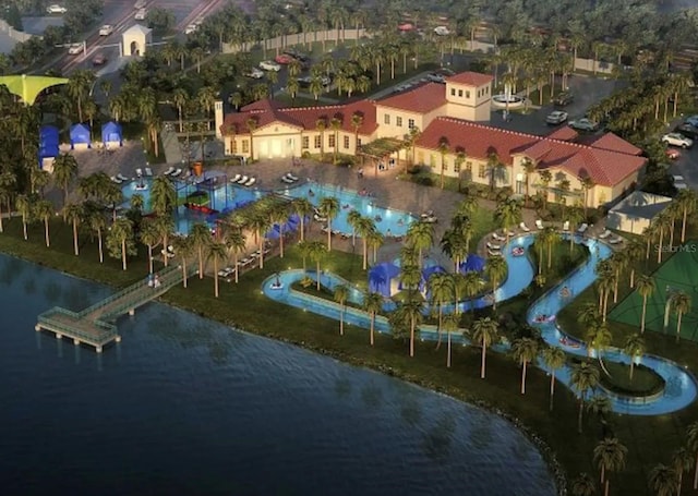 birds eye view of property with a water view