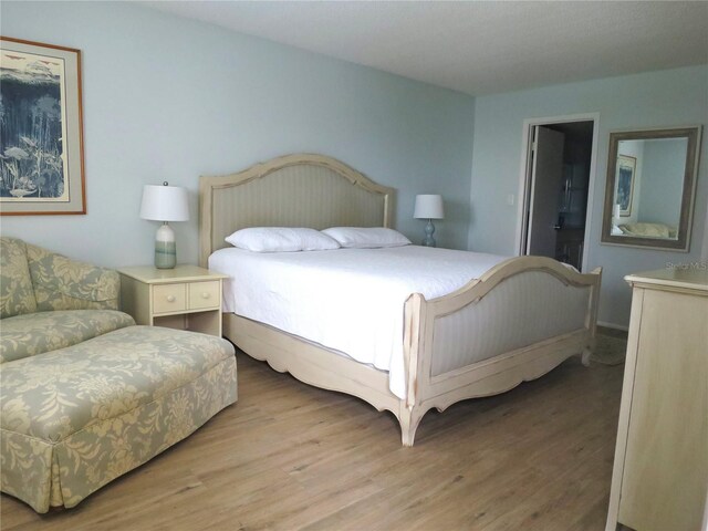 bedroom featuring wood finished floors