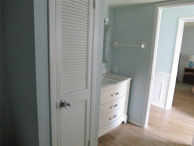 interior space with wood-type flooring and vanity