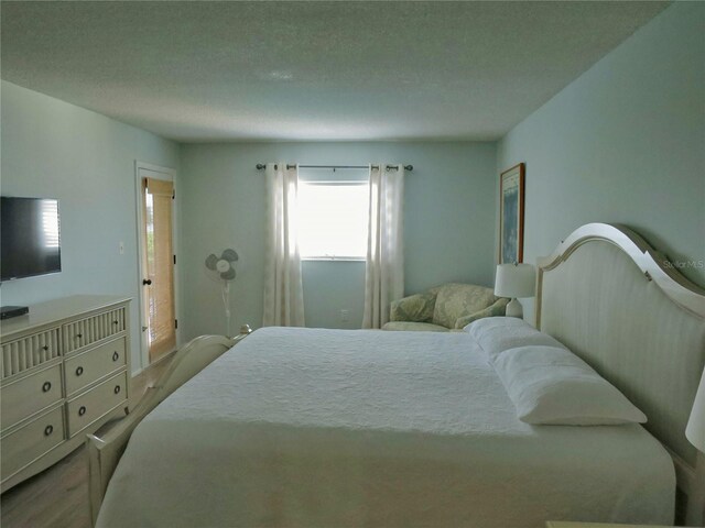 bedroom with light wood-type flooring