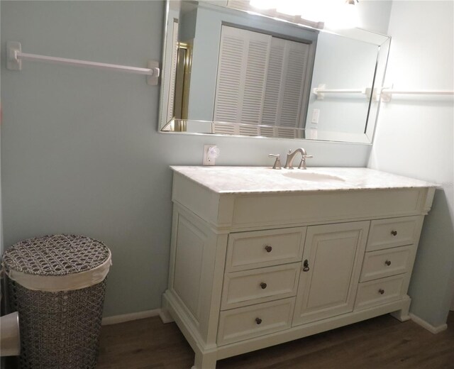 bathroom featuring vanity and wood-type flooring