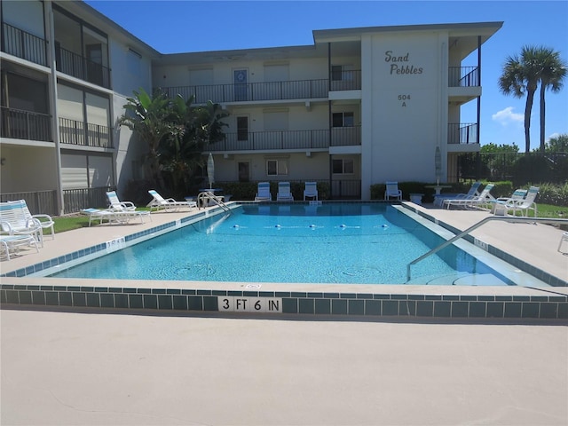 view of swimming pool with a patio area