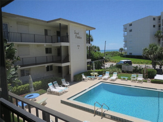 view of swimming pool featuring a patio area