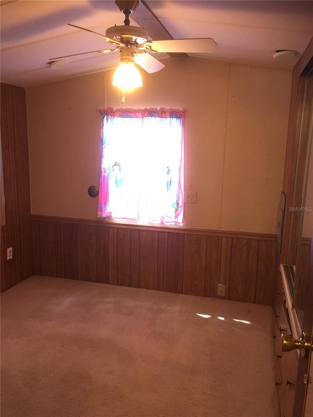 empty room with carpet flooring and ceiling fan