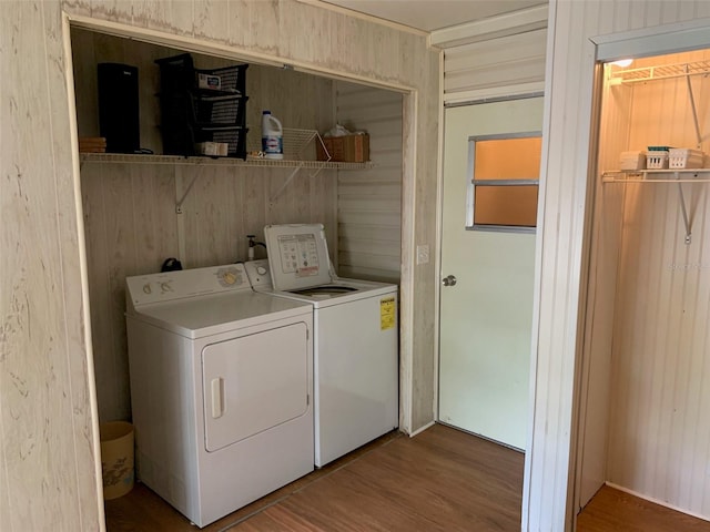 washroom featuring wood-type flooring and washer and dryer