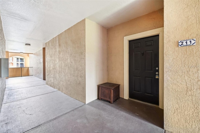 property entrance with stucco siding