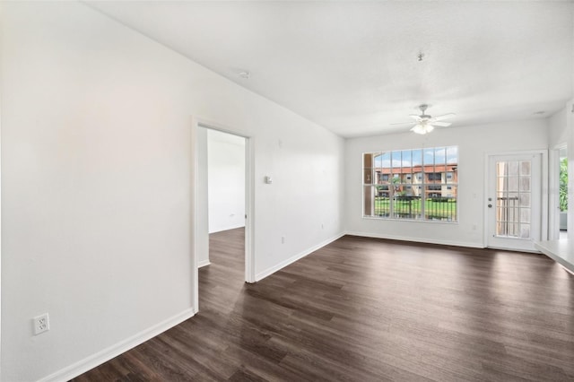 unfurnished living room featuring dark hardwood / wood-style flooring, a wealth of natural light, and ceiling fan