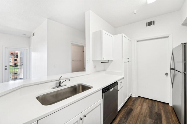 kitchen featuring sink, dark wood-type flooring, stainless steel appliances, and white cabinets