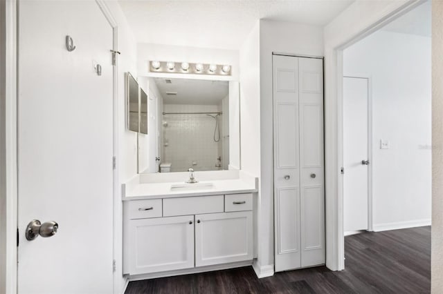 bathroom with hardwood / wood-style flooring and vanity