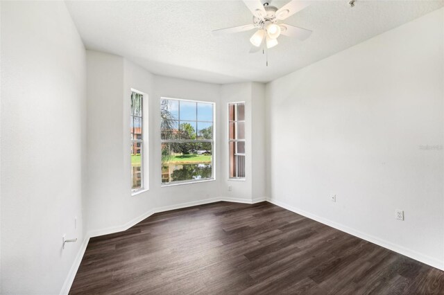 unfurnished room with ceiling fan and hardwood / wood-style flooring