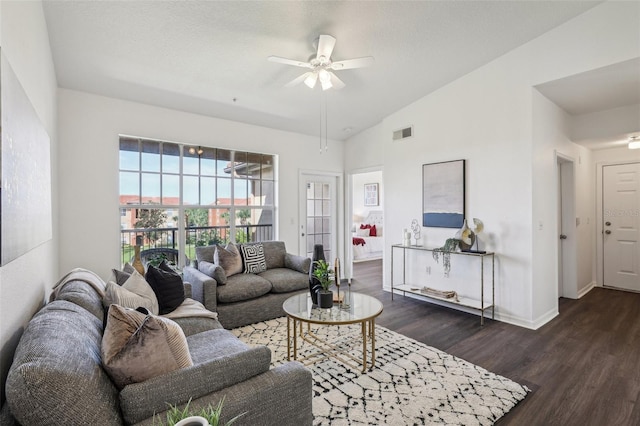 5530 Metrowest Blvd Unit 9-211, Orlando, FL 32811 - living area with dark wood-style floors, ceiling fan, baseboards, and lofted ceiling