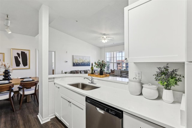 5530 Metrowest Blvd Unit 9-211, Orlando, FL 32811 - kitchen featuring dishwasher, a sink, dark wood finished floors, light countertops, and lofted ceiling