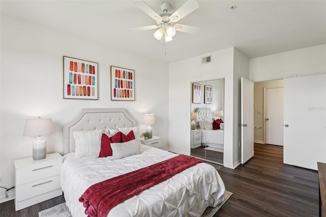5530 Metrowest Blvd Unit 9-211, Orlando, FL 32811 - bedroom with wood finished floors, a ceiling fan, and baseboards