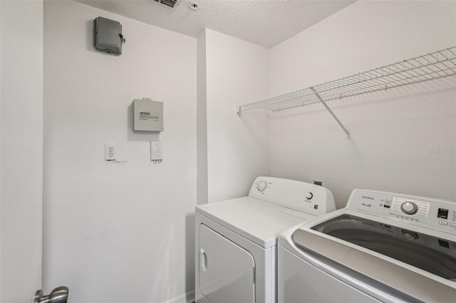 5530 Metrowest Blvd Unit 9-211, Orlando, FL 32811 - laundry room featuring washer and dryer