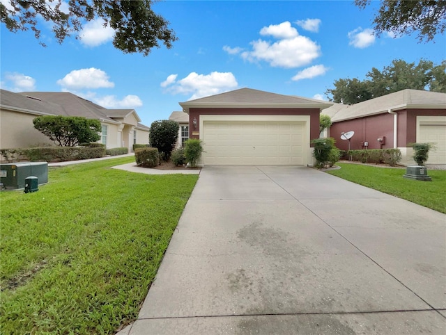 ranch-style house with a garage and a front yard