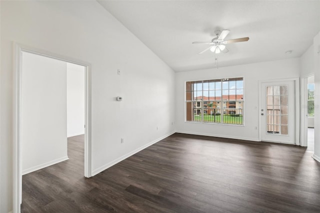 spare room featuring ceiling fan, dark hardwood / wood-style flooring, and lofted ceiling