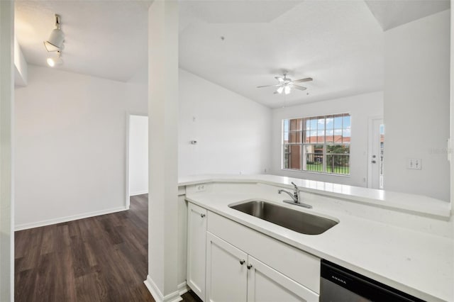 kitchen featuring stainless steel dishwasher, white cabinetry, ceiling fan, sink, and dark wood-type flooring