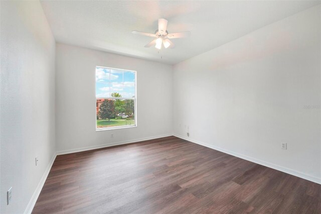 unfurnished room with ceiling fan and wood-type flooring