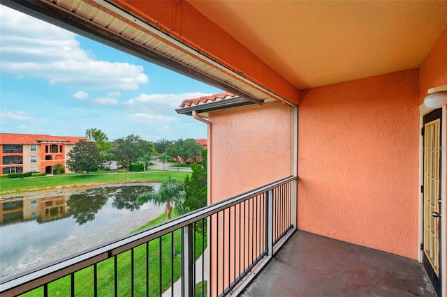 balcony featuring a water view